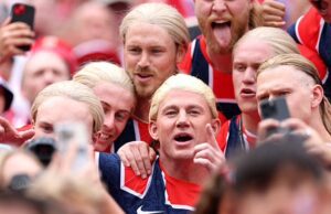 GOSSIP99 : Channing Tatum blends into a crowd of Norway fans in a blonde Erling Haaland wig at World Cup match after playing a lookalike in Nike short film
