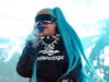 GOSSIP99 : North West, 12, takes the stage in spiked choker and blue pigtails at VERY rowdy music festival… as she gets dad Kanye’s stamp of approval