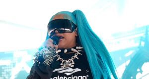 GOSSIP99 : North West, 12, takes the stage in spiked choker and blue pigtails at VERY rowdy music festival… as she gets dad Kanye’s stamp of approval