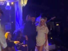 GOSSIP99 : Perrie Edwards poses in her second wedding dress and a dramatic veil as she kicks off her bridal heels while being serenaded with remix of Marry You at wild party